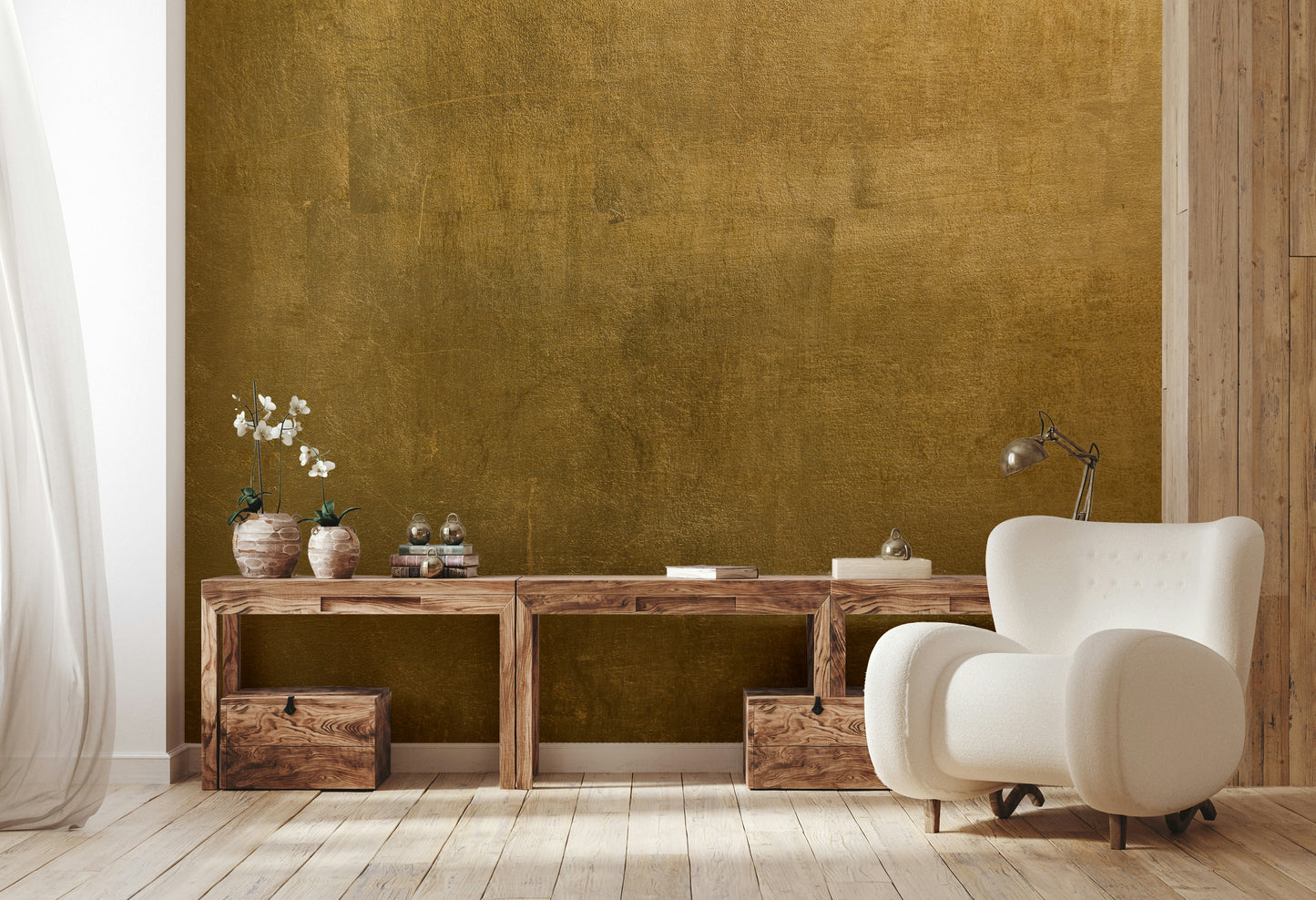 The image shows a full wall with a pattern that resembles aged, gilded metal or plaster.