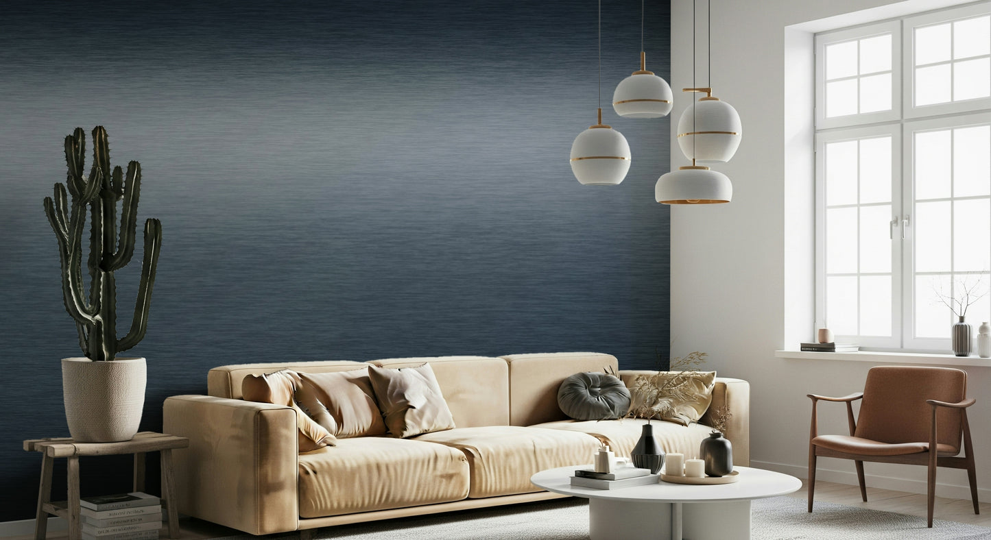 The colors are soft, muted tones of midnight blue and silver.