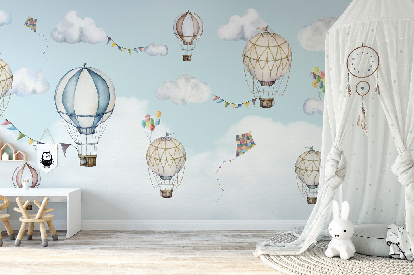 Colorful balloons mural set against a bright sky.