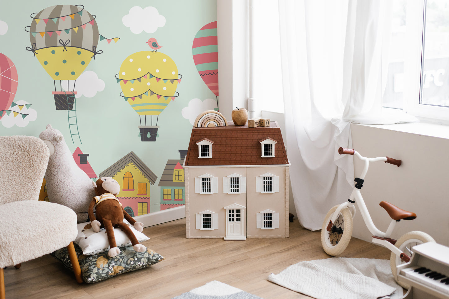 Playful nursery mural with floating balloons of imagination.