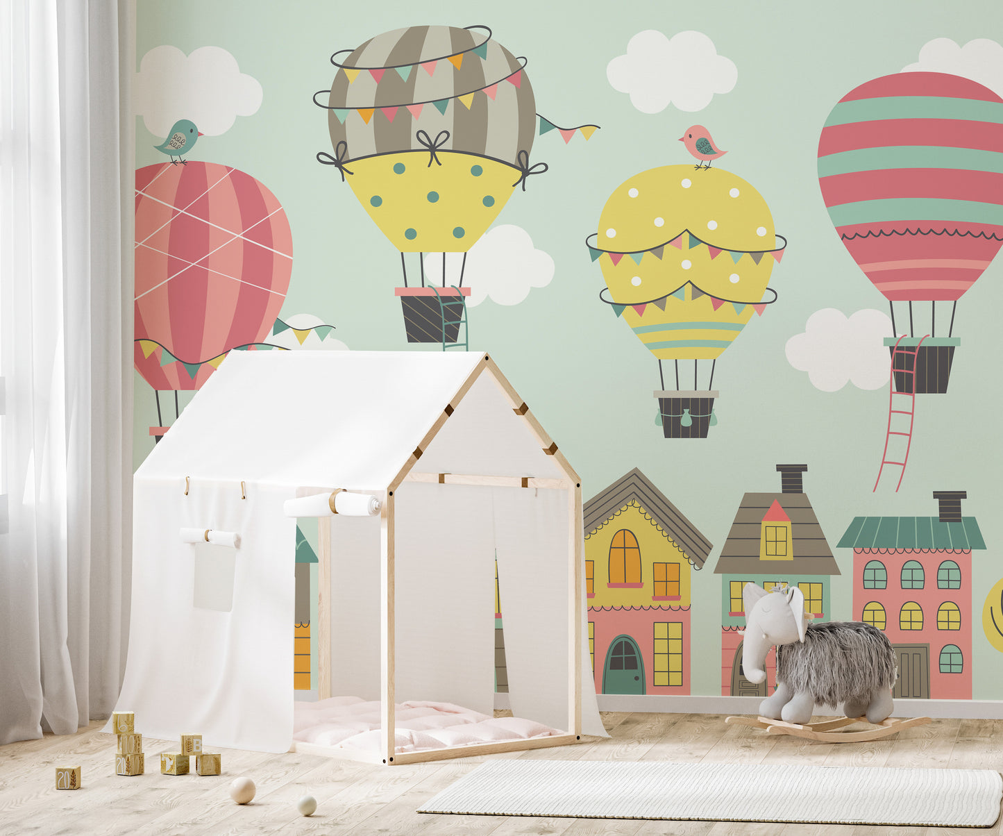 Colorful balloons mural inspiring creativity in nursery decor.