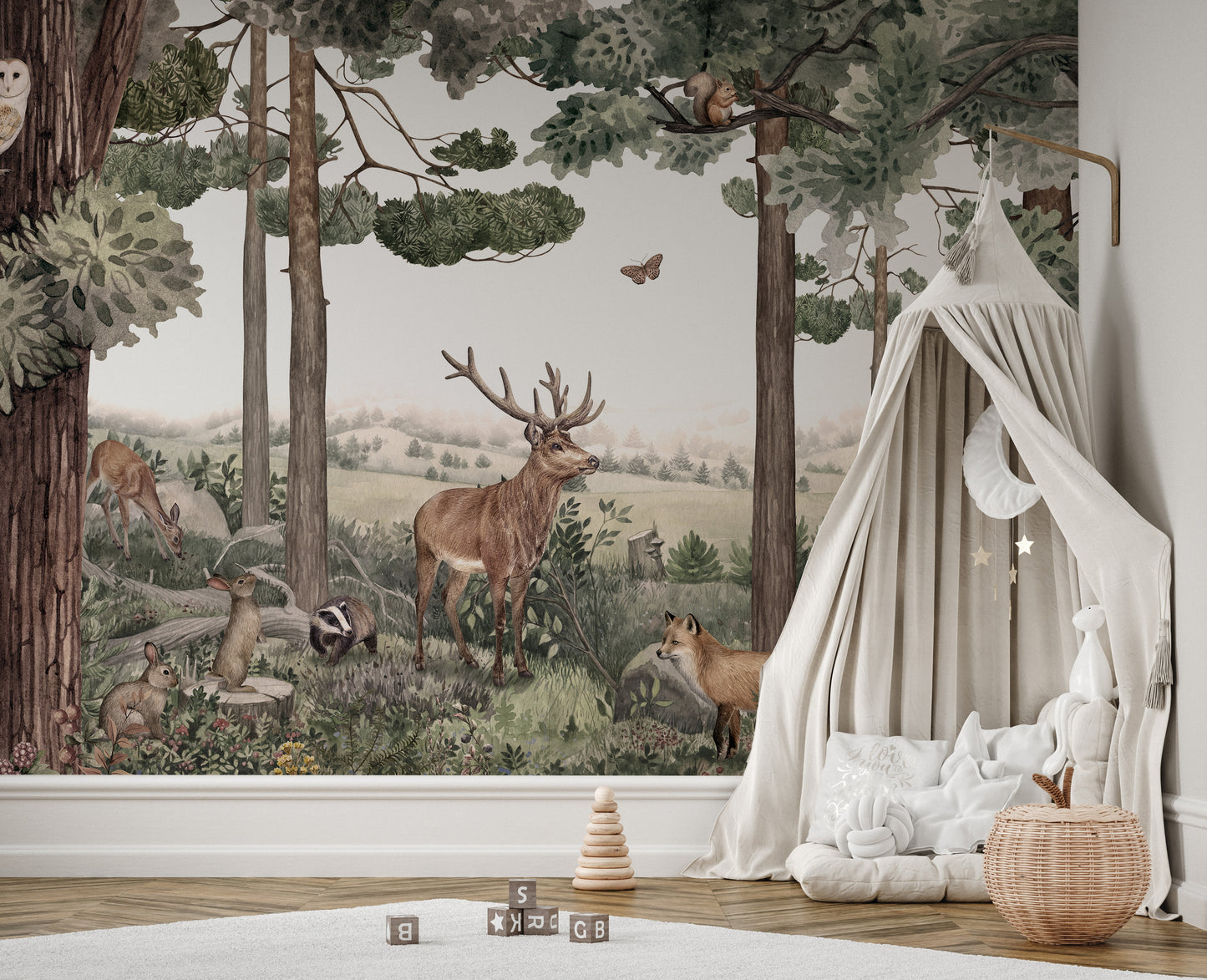 Wildlife-inspired mural with stag and deer in the forest.