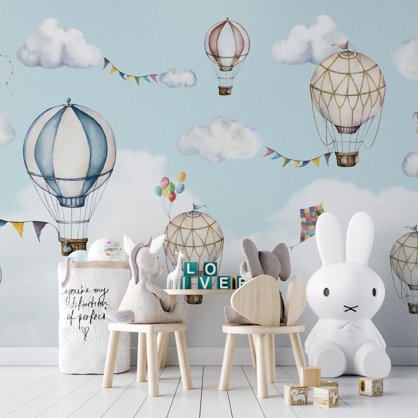 Scenic sky mural featuring floating balloons in motion.