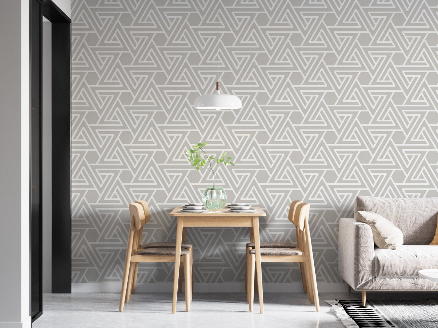 Geometric line pattern wallpaper in a dining area with wooden chairs.