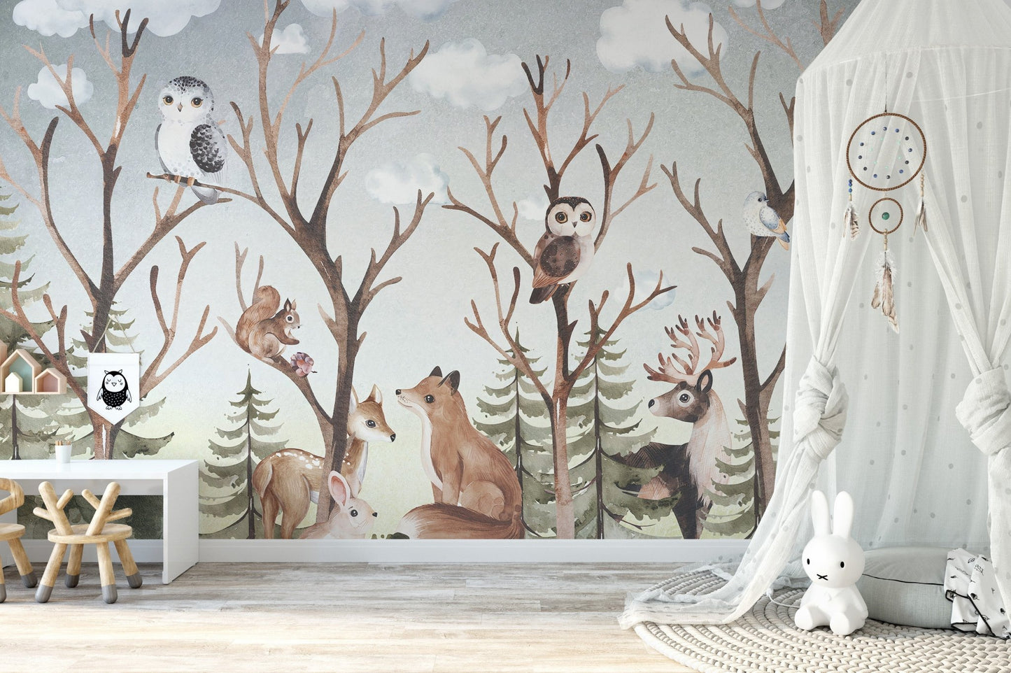 Animals brown tropical forest wall mural with a white teepee and wooden toys.