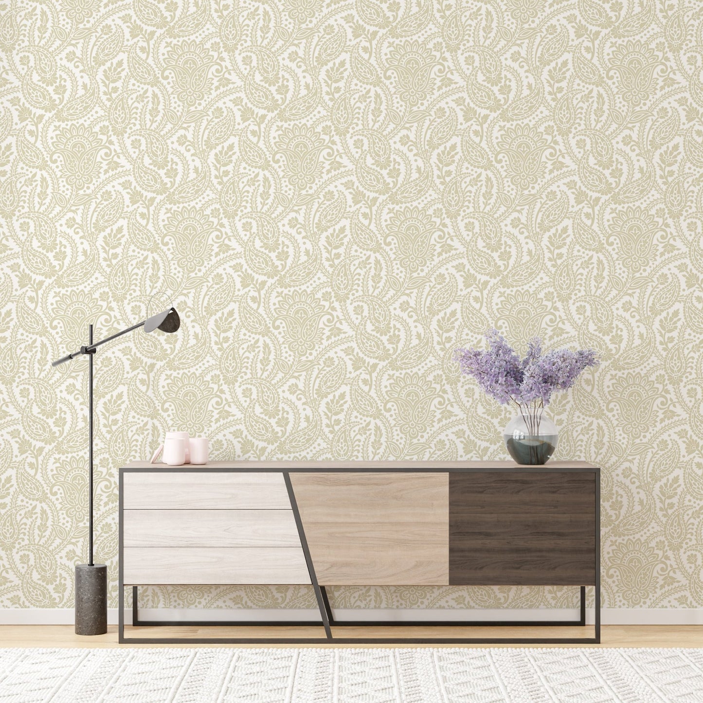 Modern console table and lamp in front of a honey paisley wallpaper.