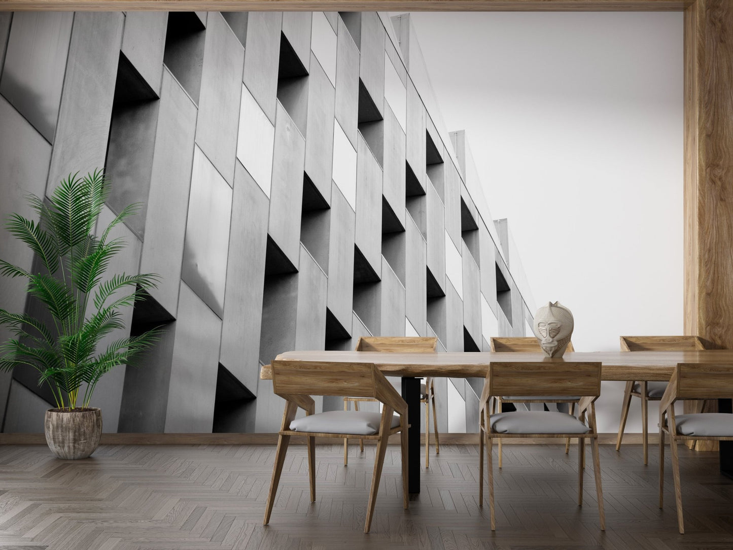 Dining room wall mural with sharp geometric structural patterns and wooden chairs.