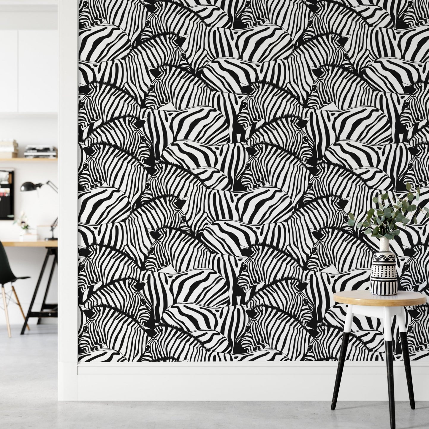 Zebra print wallpaper in a hallway area with a small round side table.