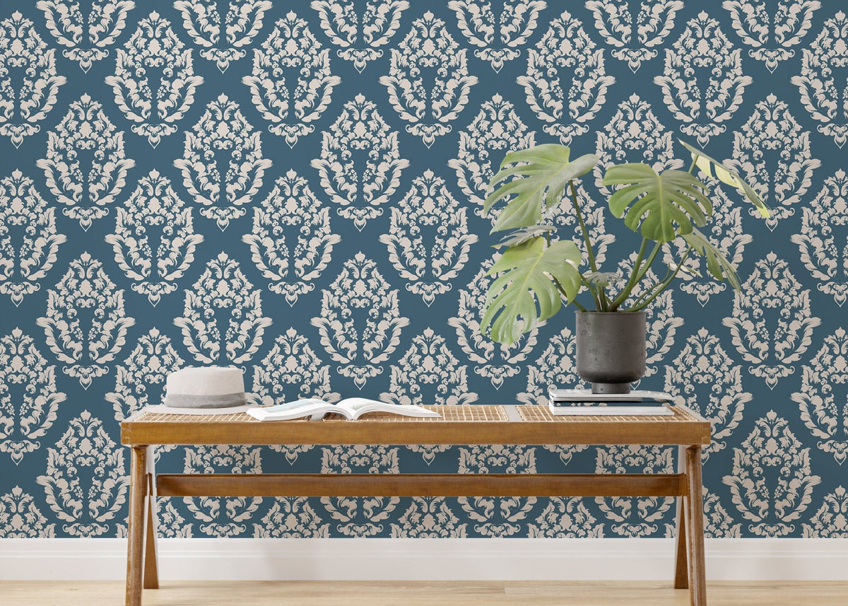 Blue Baroque wallpaper styled with indoor plants and wooden furniture.