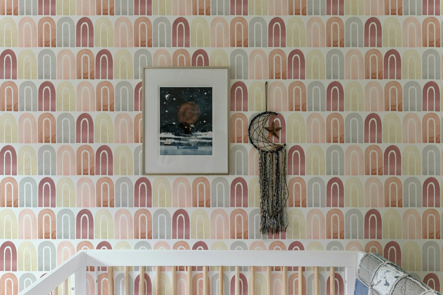 Terracotta and gold shape wallpaper in kids bedroom with white bed.