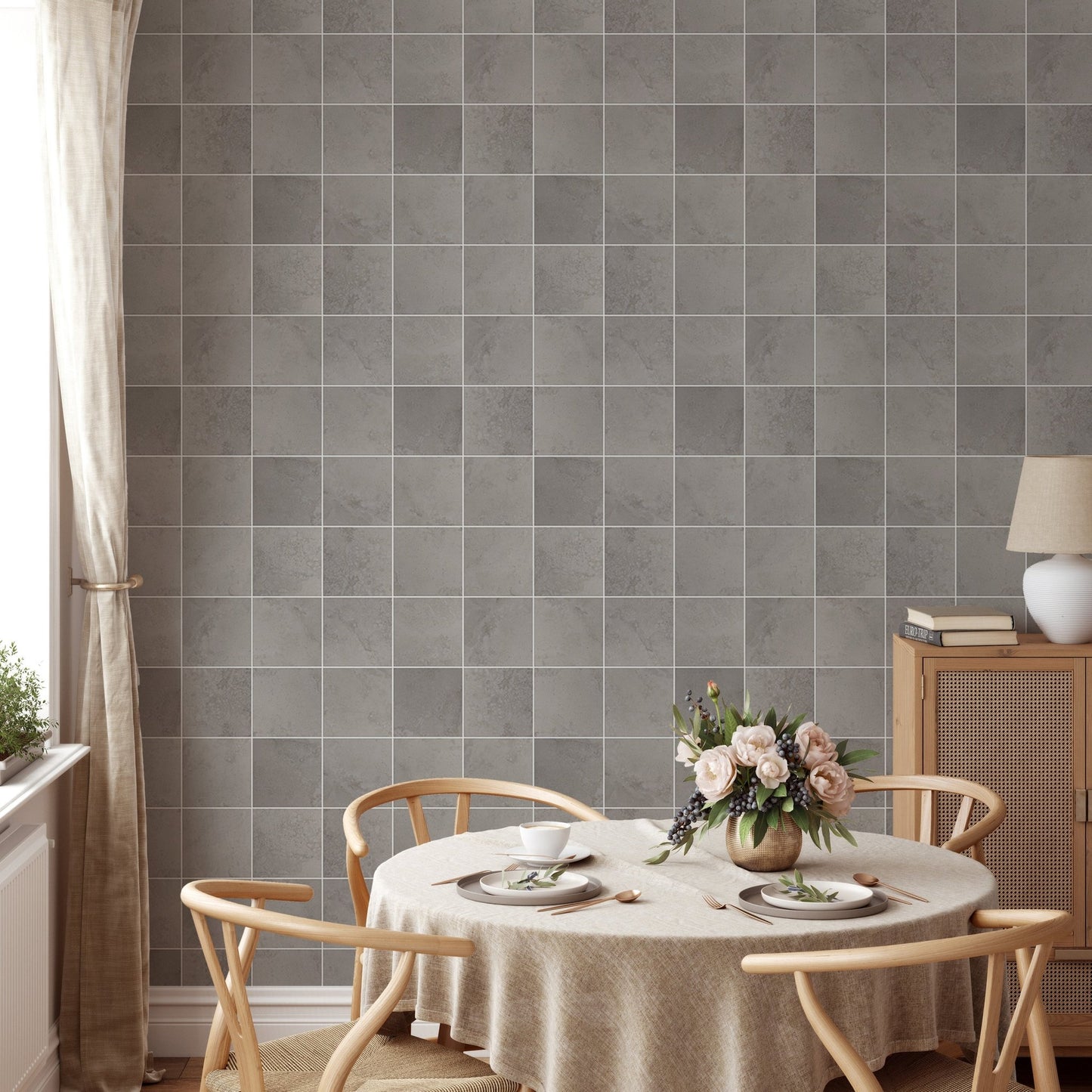 Matte grey tile wallpaper behind a circular wooden dining set in dining area.