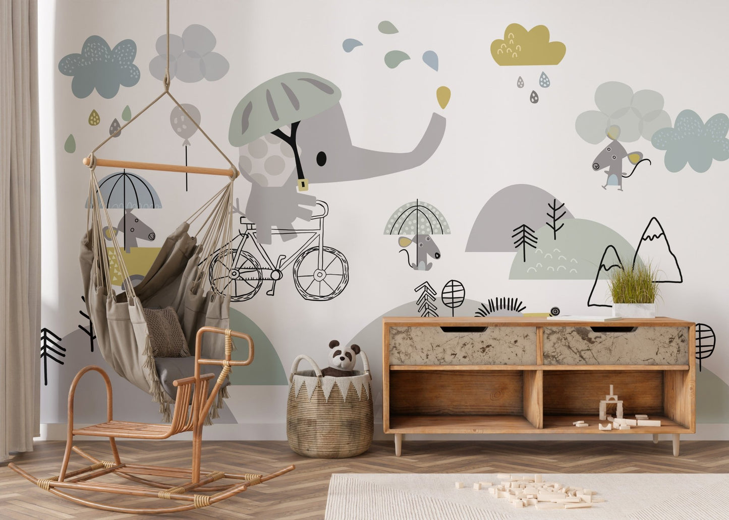 Modern playroom with a wooden sideboard and elephant bicycle wall mural.