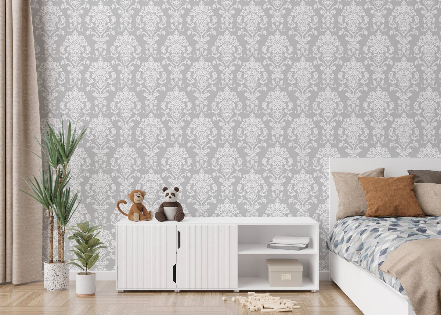 Minimalist damask wallpaper in a child's bedroom with white storage cabinets.