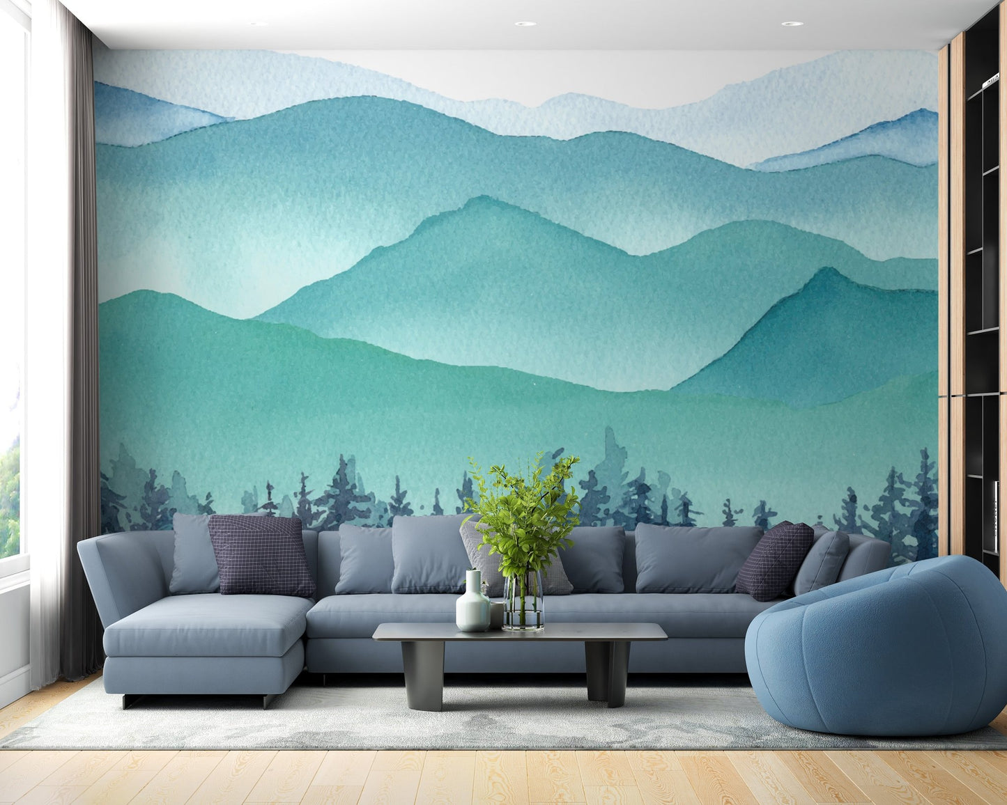 Navy blue sectional sofa set against a watercolor mountain wall mural.