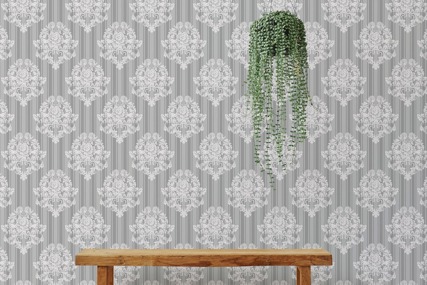 Vintage damask wallpaper behind a wooden bench and hanging plant.