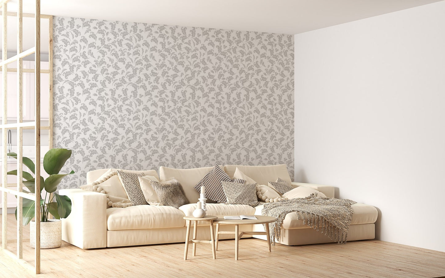 Grey and white damask wallpaper behind a beige sofa in a bright living area.