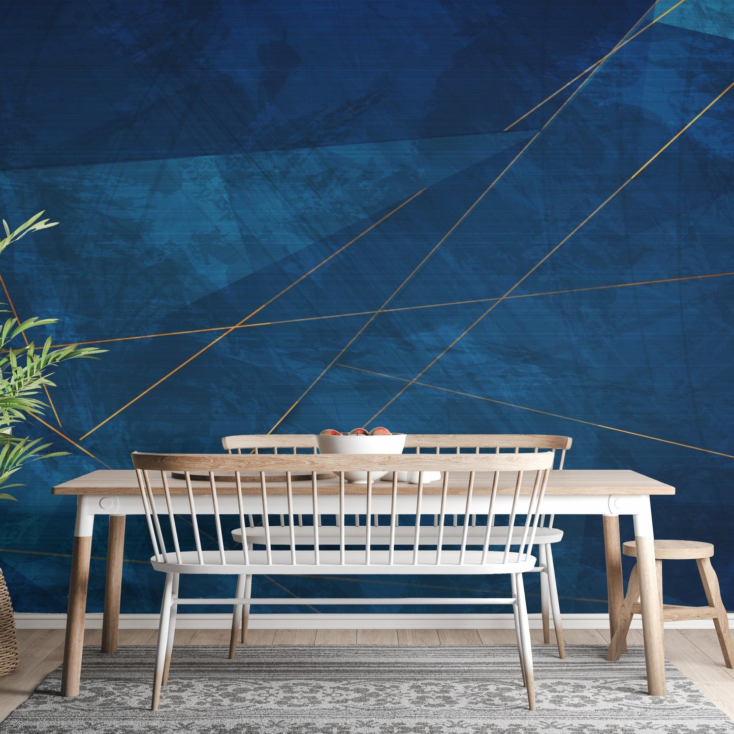 Navy blue abstract wall mural behind a dining table with wooden chairs and bench.
