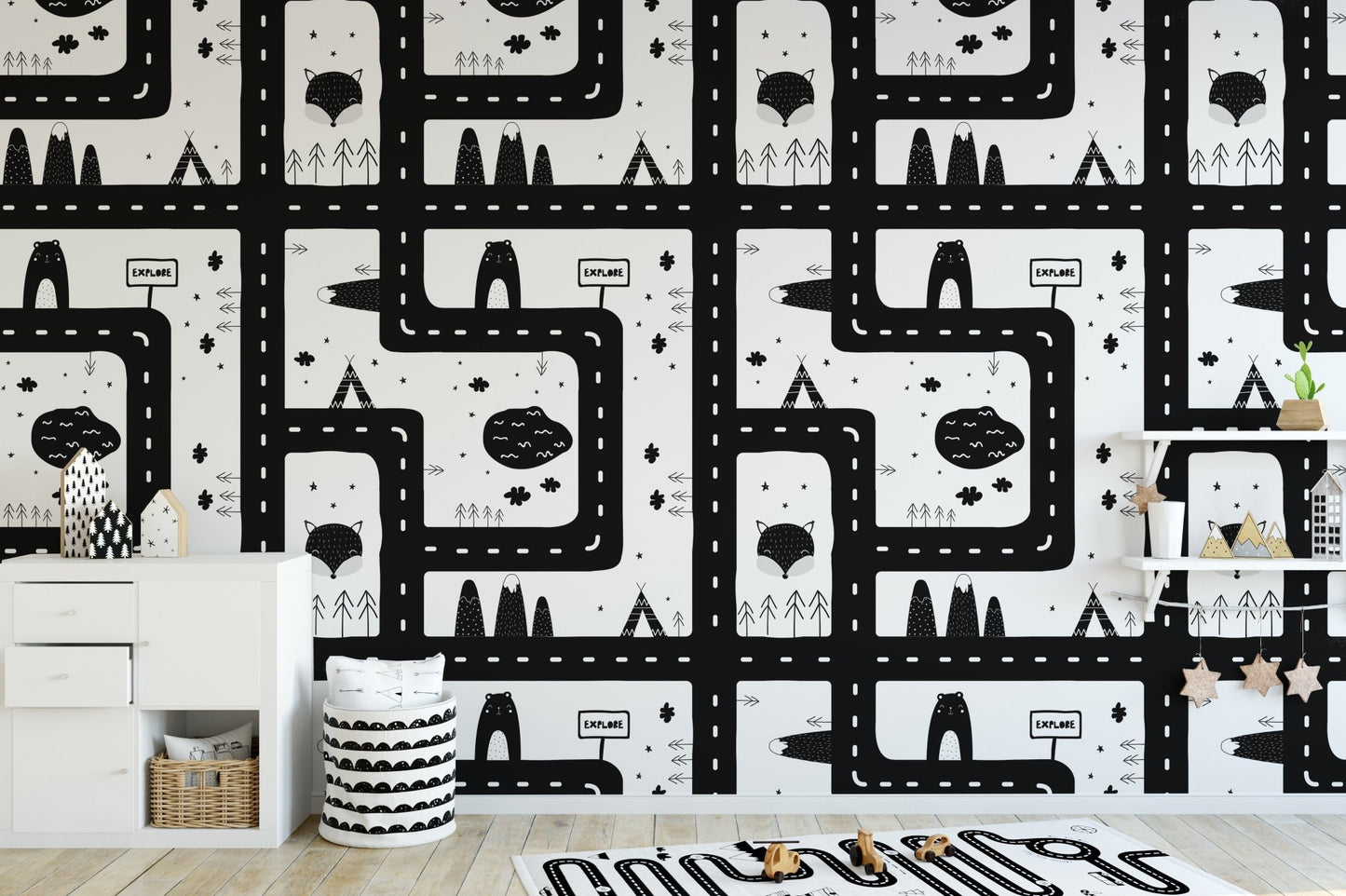 Black and white cityscape pattern wallpaper for a modern kids' room.