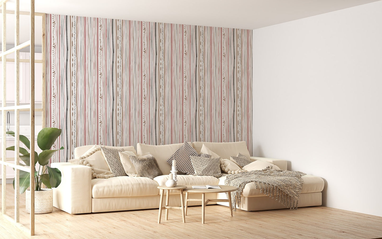Striped pastel wallpaper behind a beige sofa in a living room.