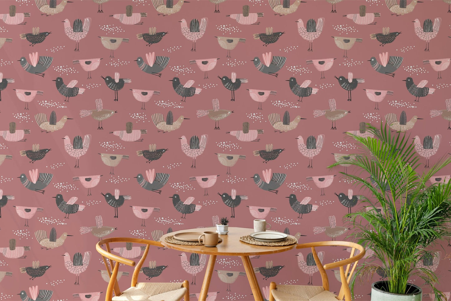 Dark pink wallpaper with hand-drawn pastel bird elements in dining room.