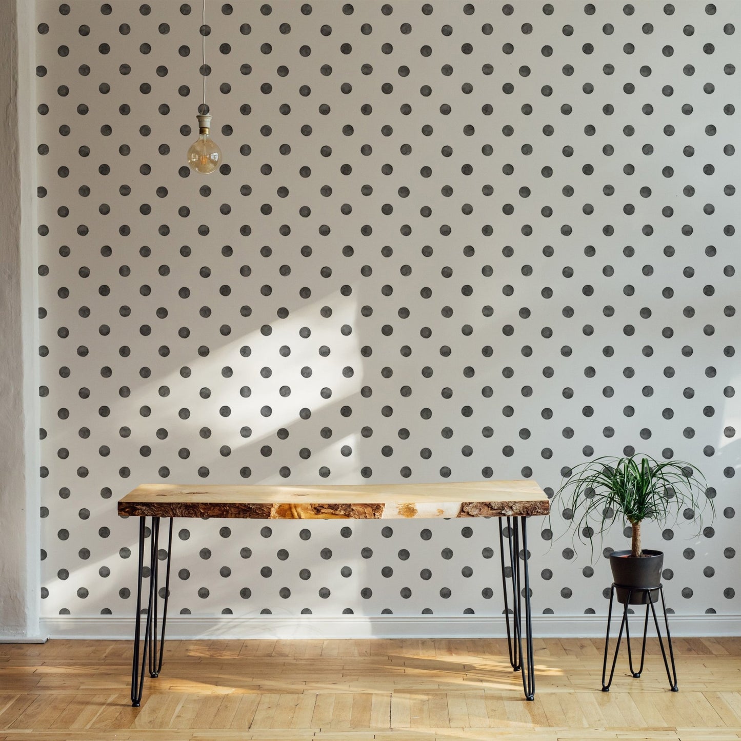 Modern hallway with a thin console table and dot wallpaper.