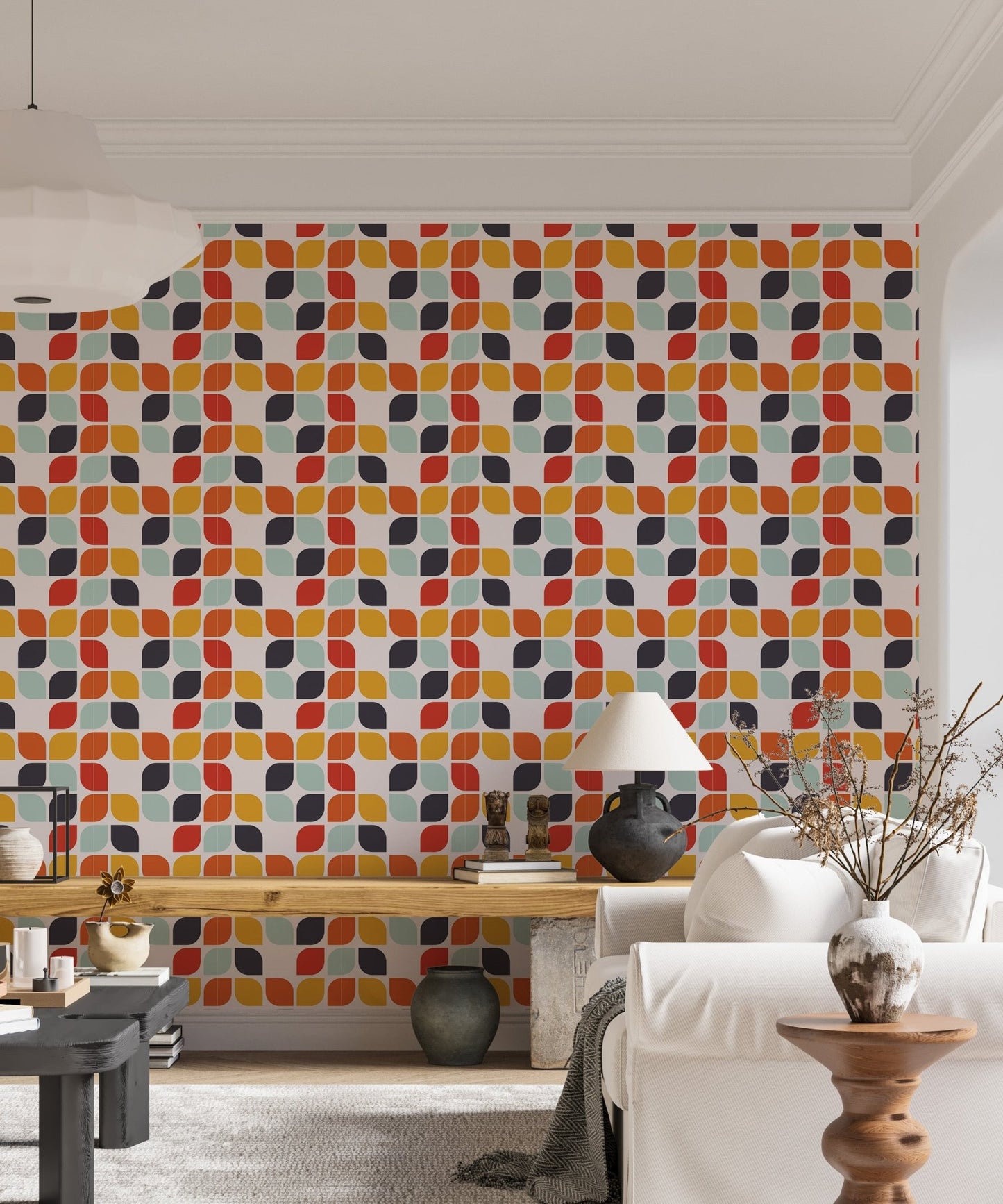 Living area wall mural featuring orange and teal geometric shapes behind a white sofa.