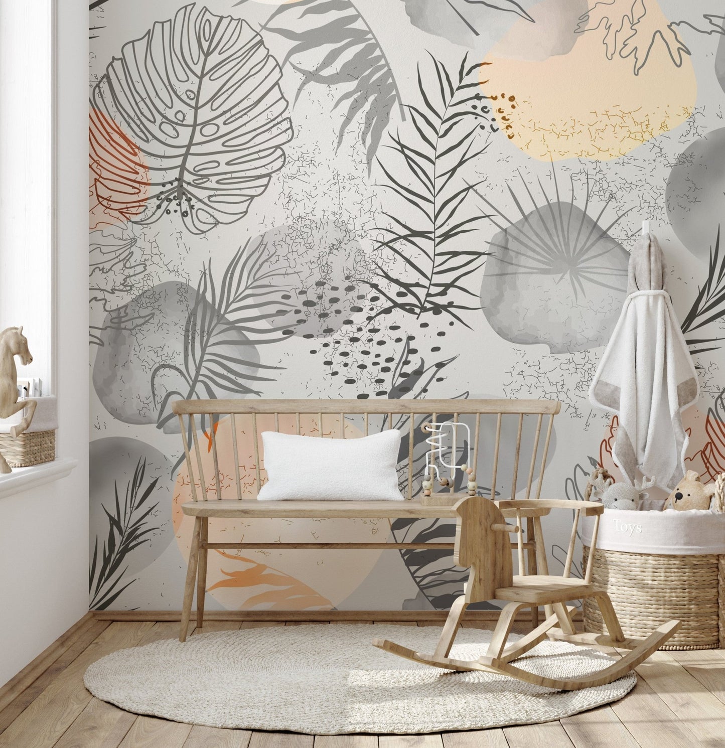Tropical mural with hand-drawn leaves for chic, natural decor in play area.