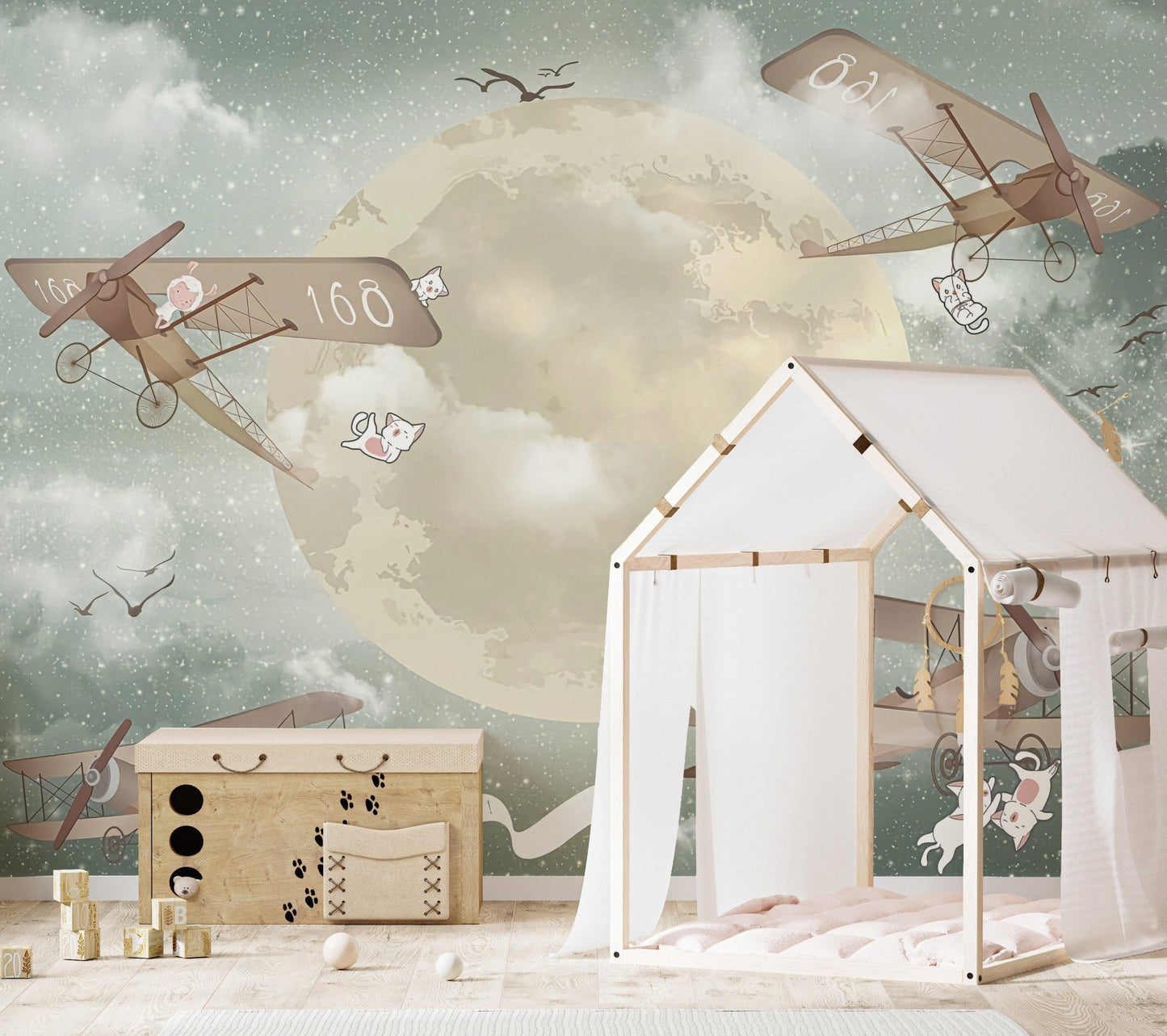 Skyward gliders wall mural with celestial details in kids room.