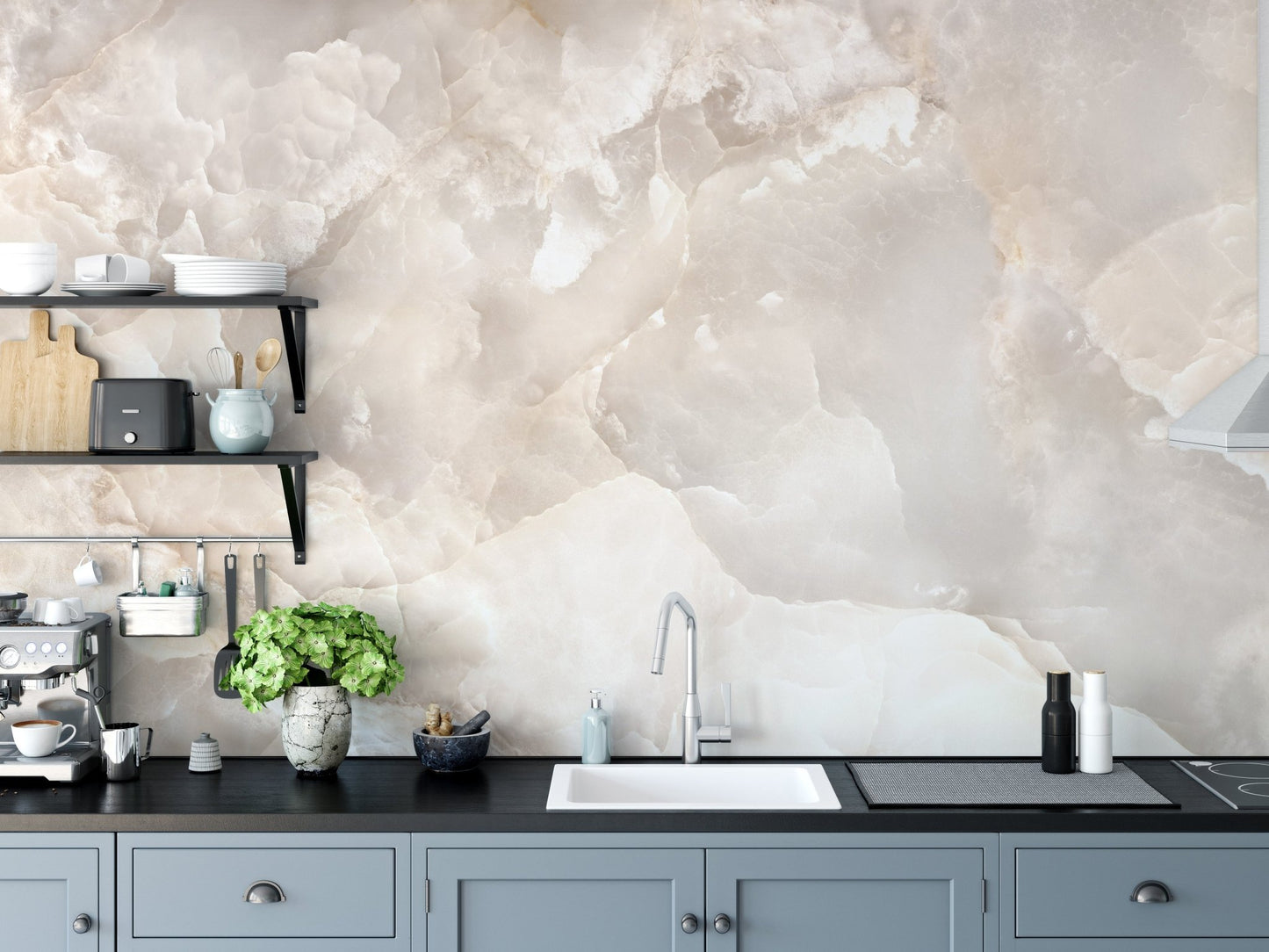 Stone texture wall mural behind a kitchen sink and black cabinetry.