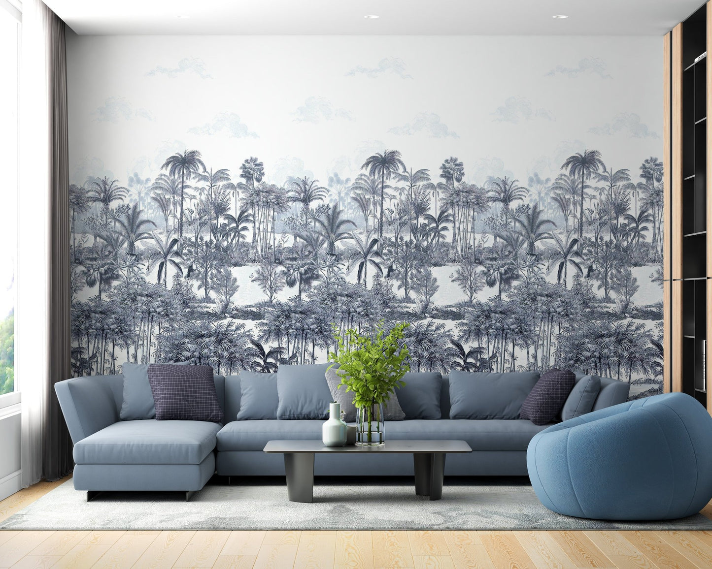 Tropical Forest Blue Wall mural in a living area with a blue sofa.