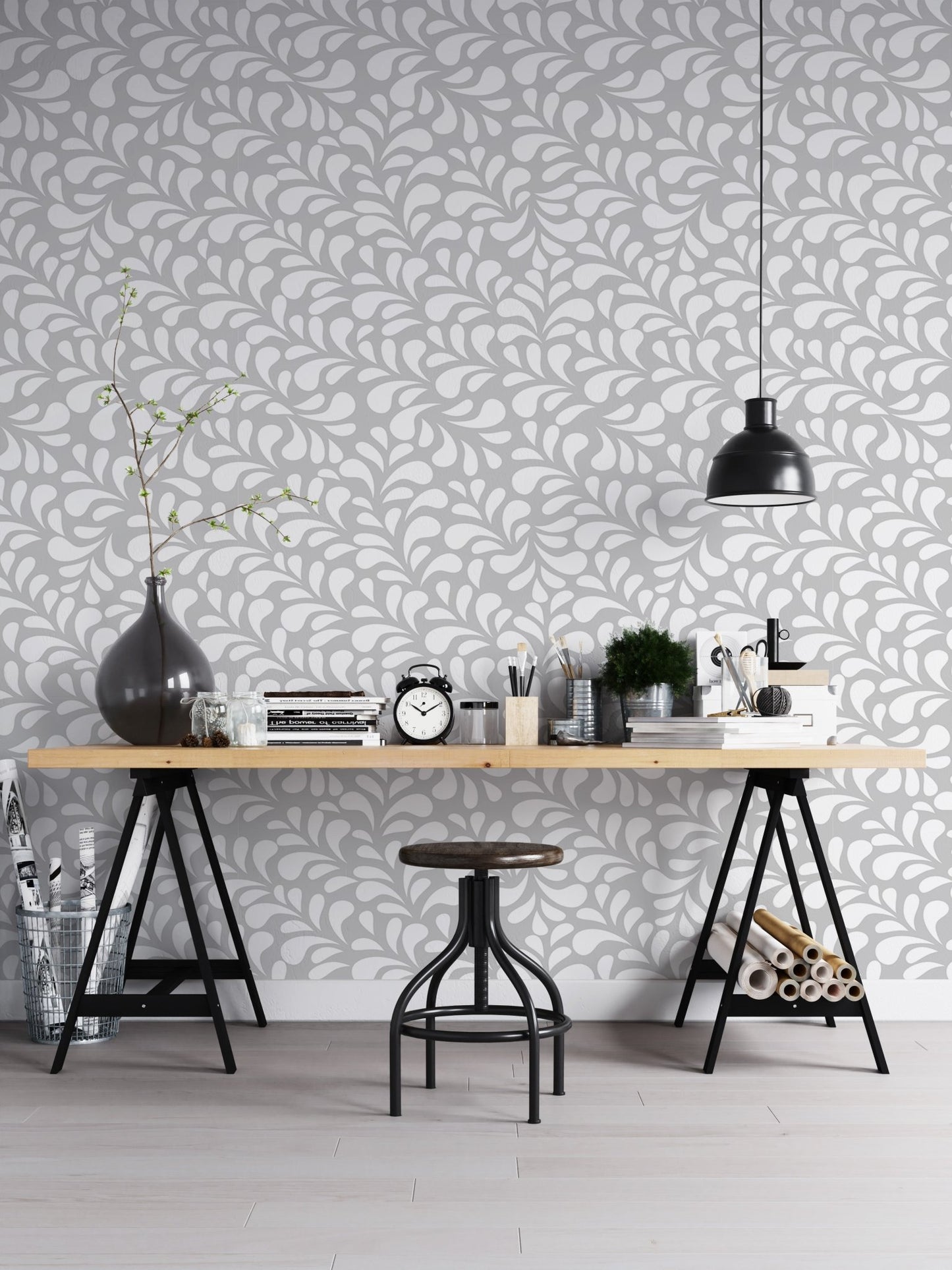 Minimalist damask wallpaper in home office space with black chair and table.