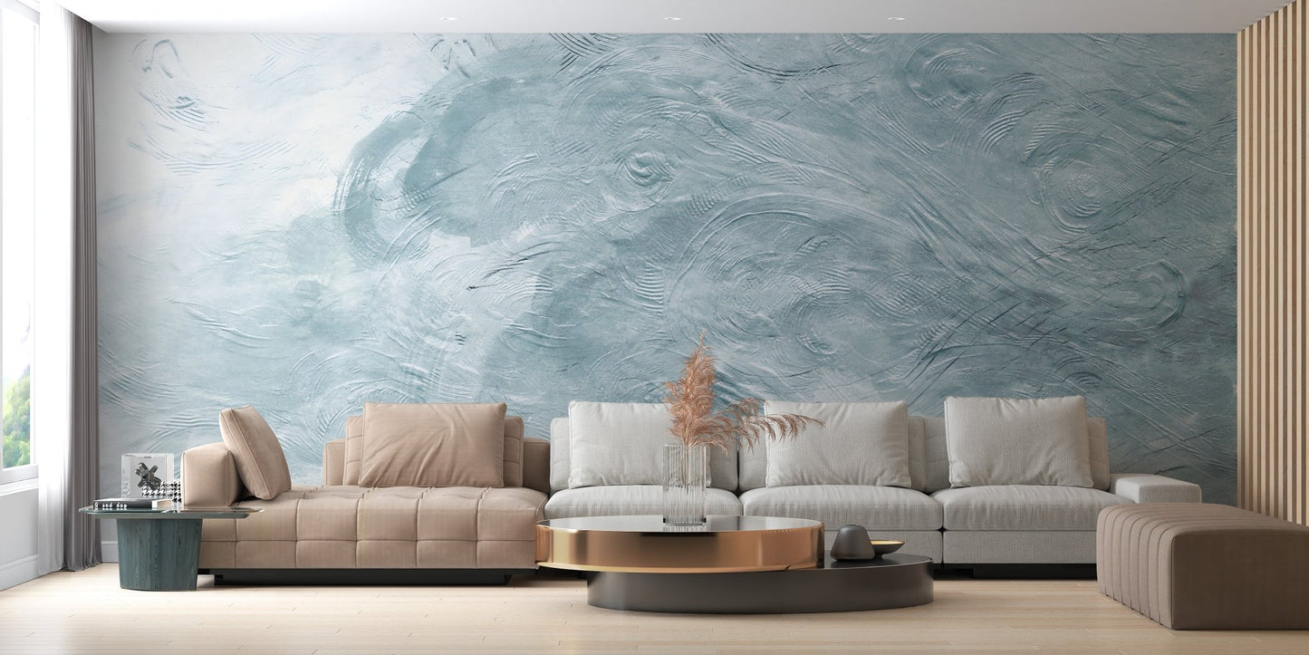 Textural blue wave wall mural in a minimalist room with a brown sofa.
