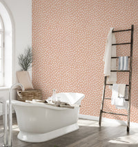 Abstract polka dot wallpaper in beige and white.
