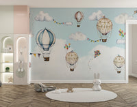 Artistic mural showcasing balloons drifting in the sky.
