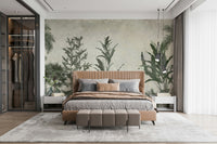 A wall mural featuring a serene landscape of rolling green hills and scattered trees.

