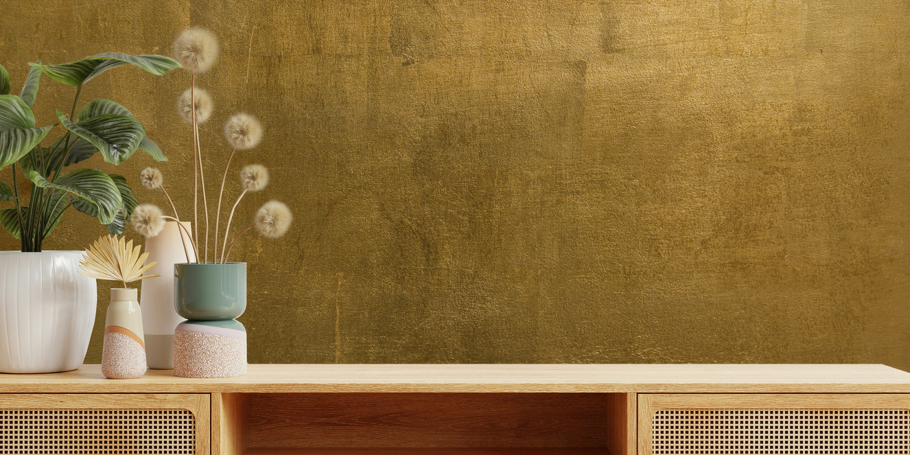 A wall mural featuring a rich, textured pattern in golden tones.