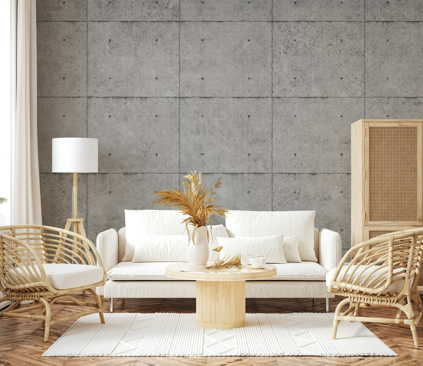 The mural is installed in a minimalist living room behind a simple, black sofa.

