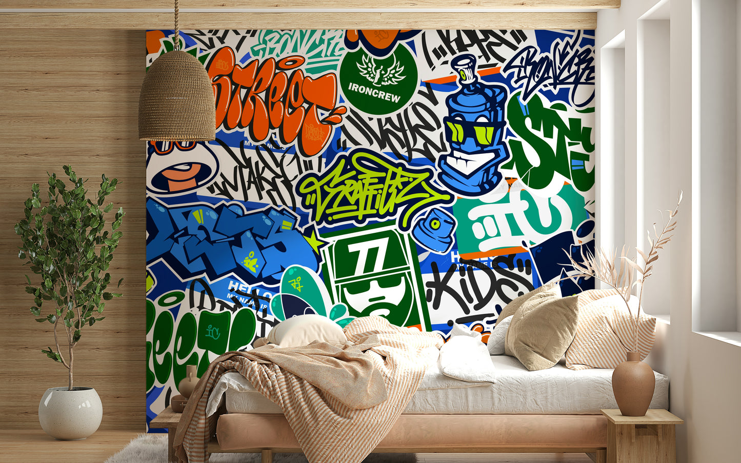 A close-up view shows the texture and distinct lines of the various graffiti tags.

