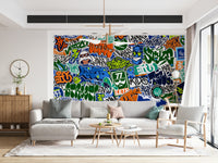 The mural is installed in a teen's bedroom behind a simple metal bed frame.

