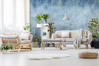 A wall mural featuring a serene forest of tall, bare trees.

