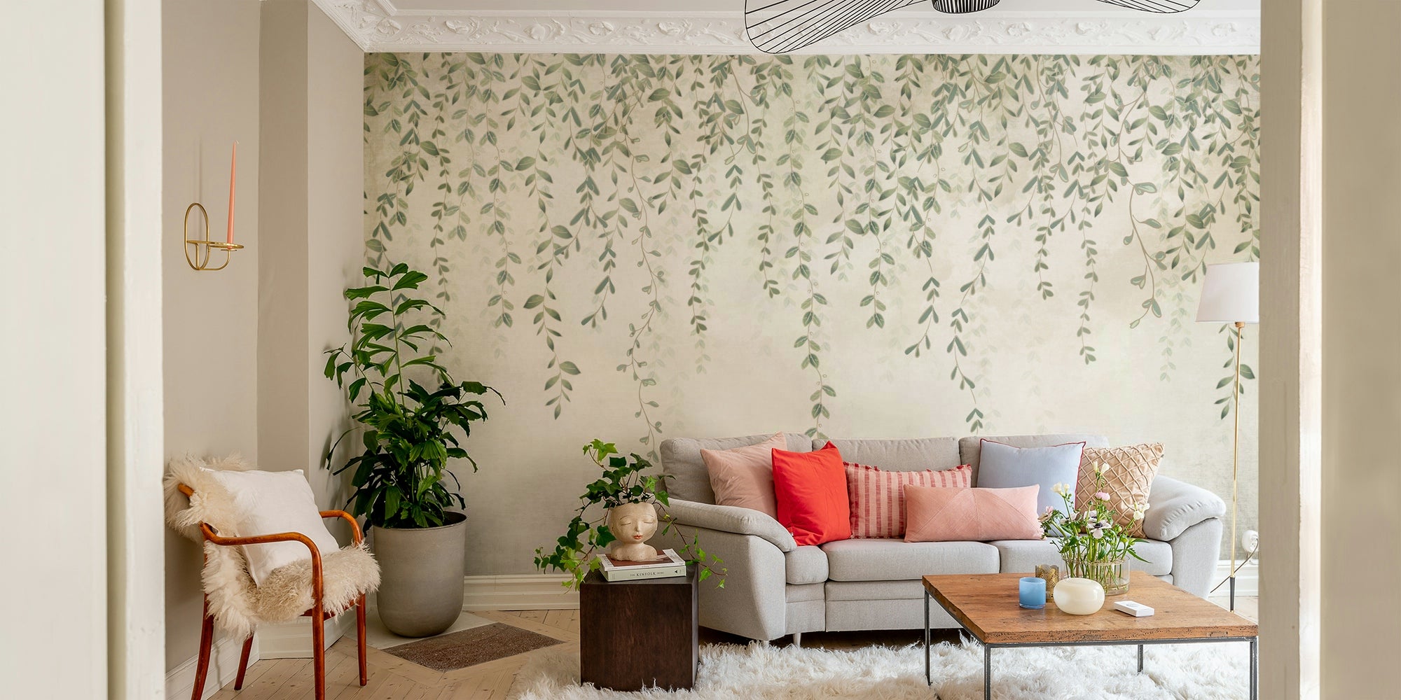 The mural is installed in a bedroom behind a simple wooden bed frame.

