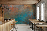 The colors are soft, muted tones of bronze and gray.

