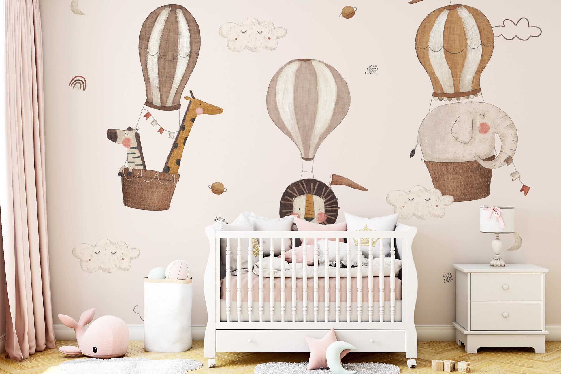 Whimsical nursery wallpaper featuring hand-painted animals in floating baskets.
