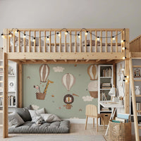 Illustrated elephant and giraffe ballooning on a green wallpaper.