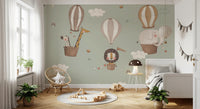 Nursery wallpaper featuring a lion in a striped hot air balloon.