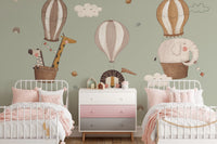 Sage green wallpaper with sleepy clouds and celestial gold planets.