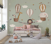 Hand-drawn jungle animals in balloons for a whimsical wall mural.