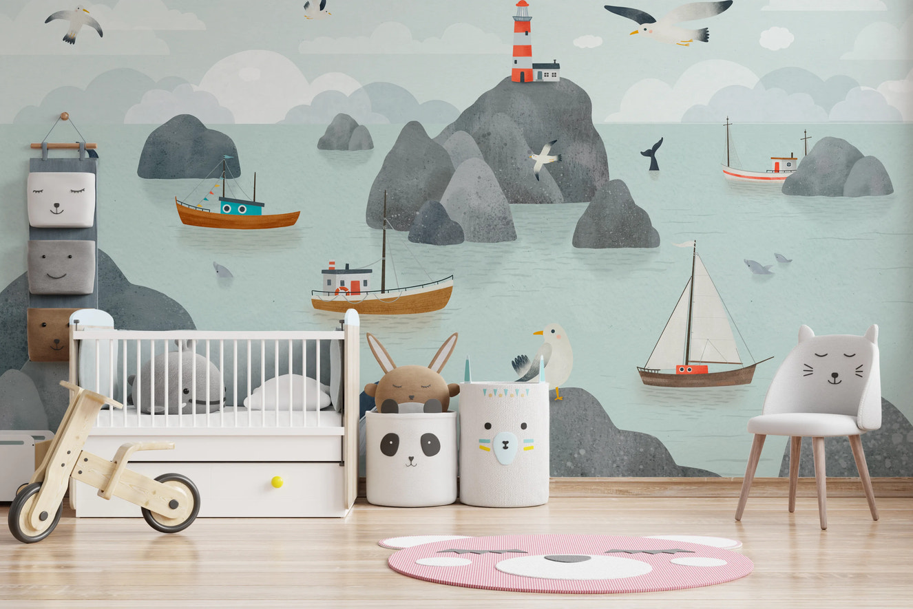 Minimalist nursery with a sea themed wall mural and wooden toys on a round rug.
