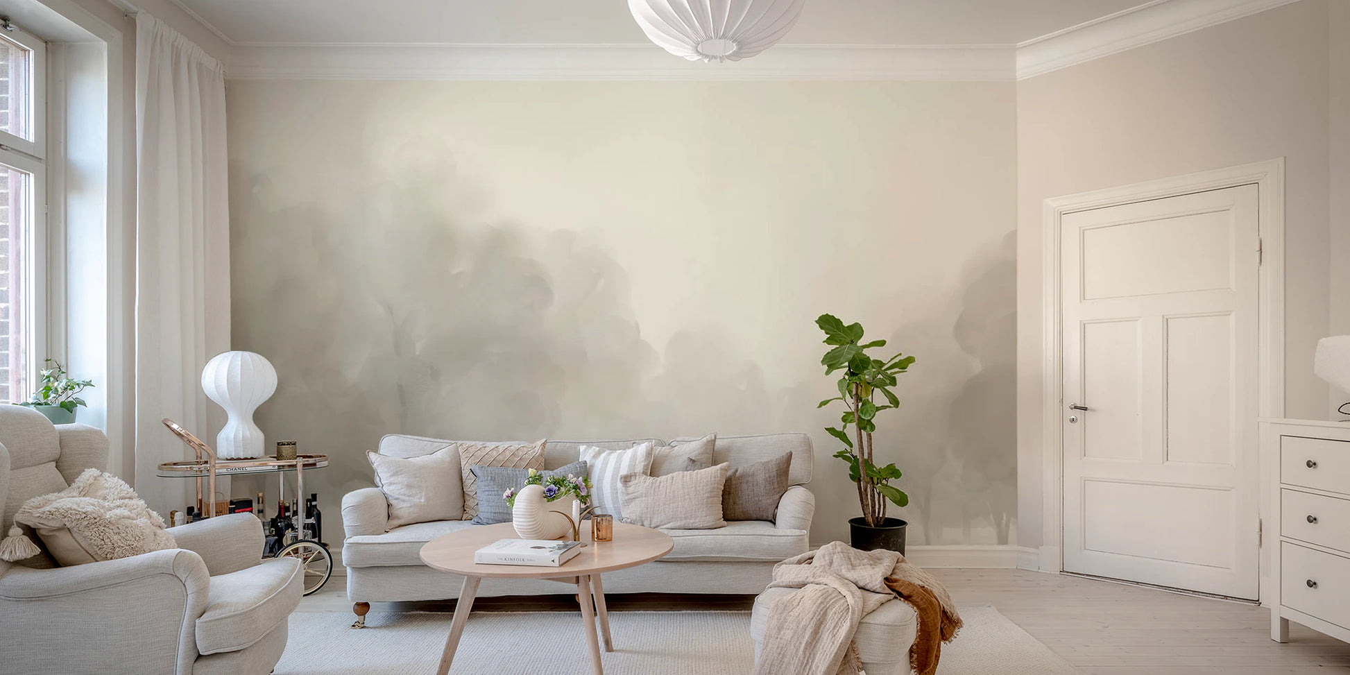 Living room wall mural displaying abstract misty Blooms in neutral grey.