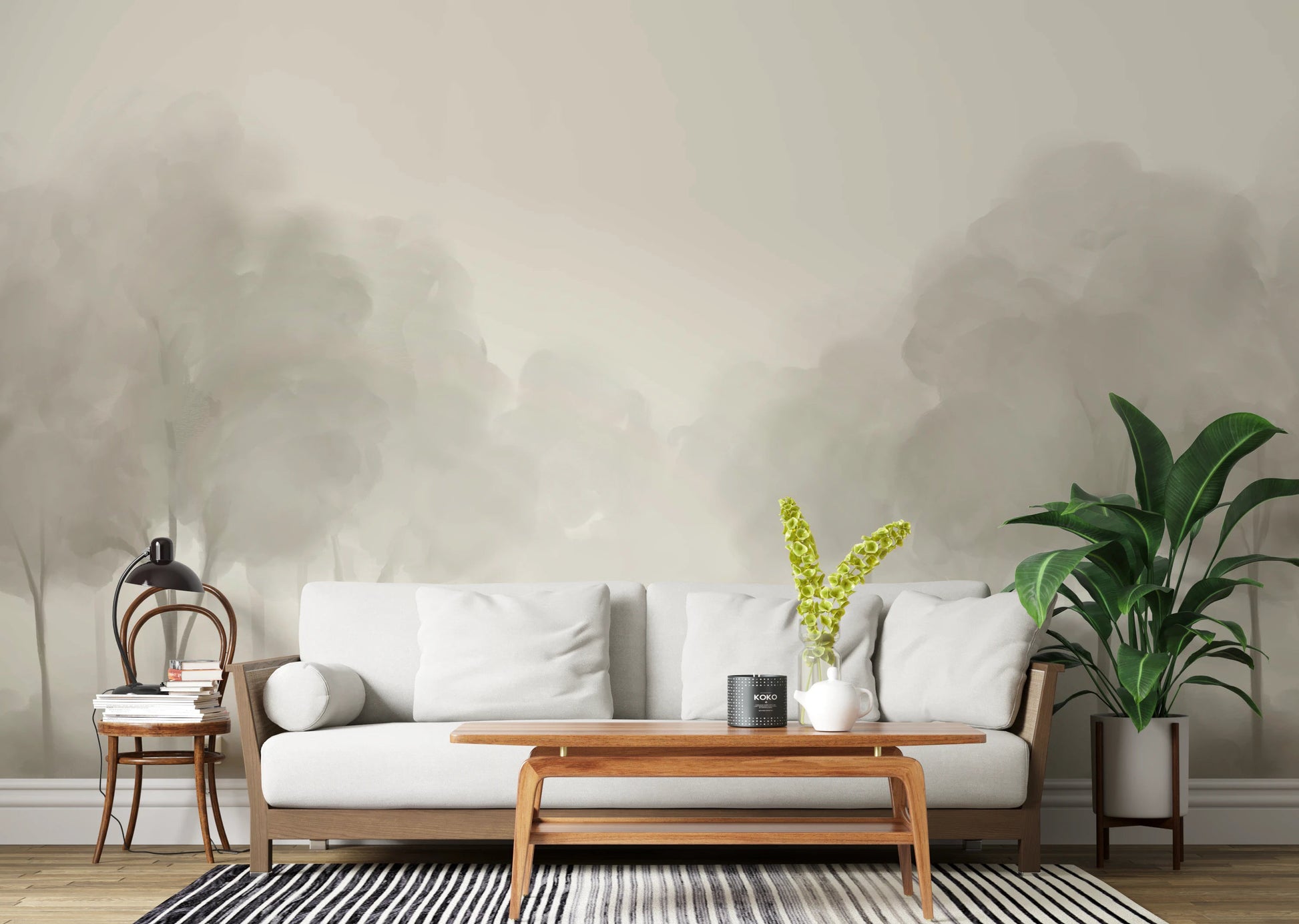 Whispering Blooms Wall Mural with soft grey tree landscape in living room.
